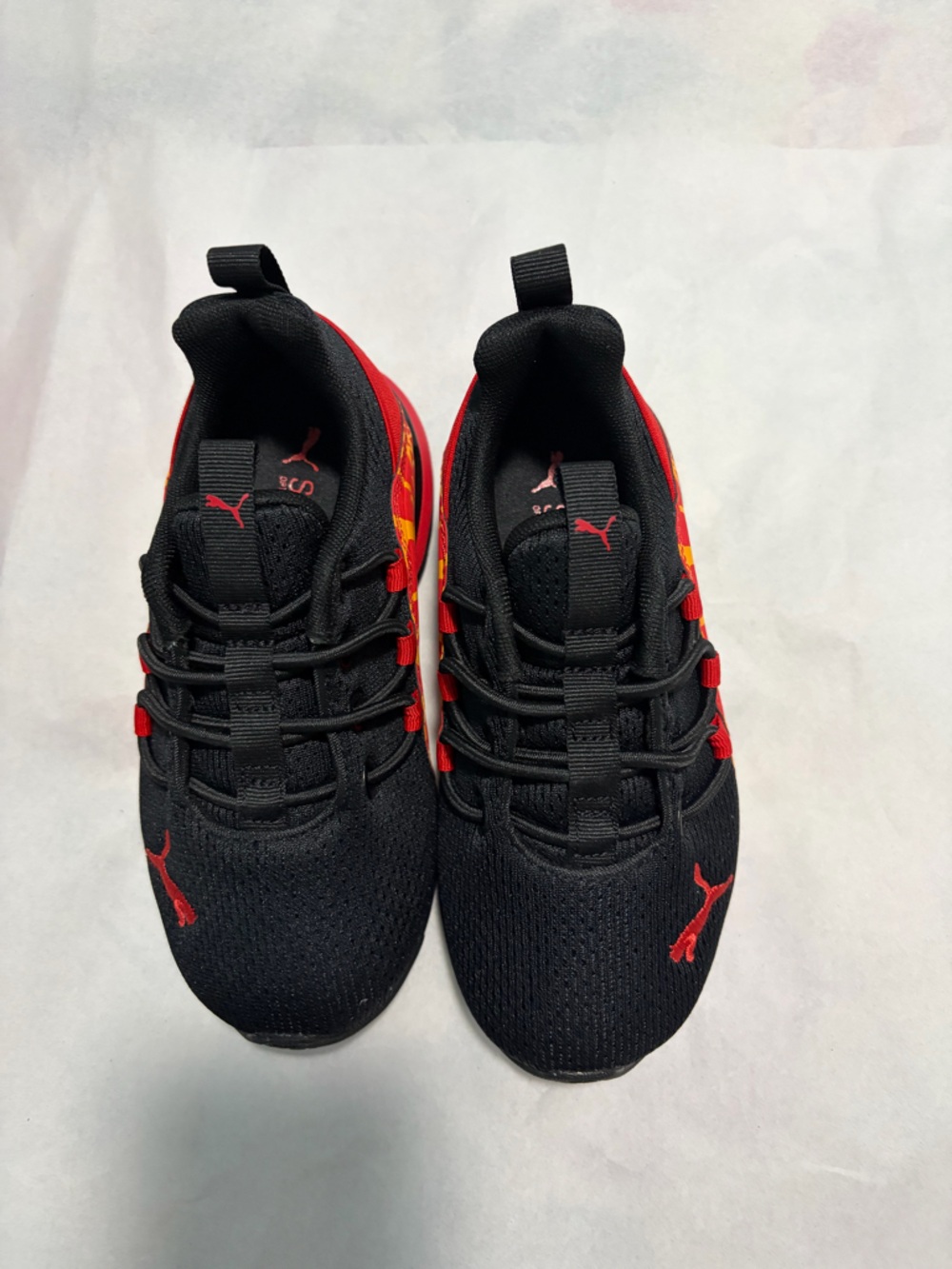 Puma Black Sneakers with Red Accents